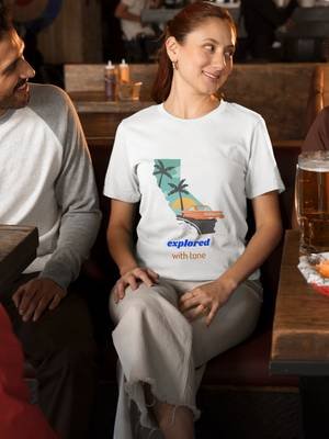 bella-canvas-t-shirt-video-featuring-a-smiling-woman-enjoying-her-time-with-friends-in-a-sports-bar-8624v####