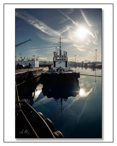 Morning over the Tug Response in the Port of Seattle — sun blazing, water like a mirror, Mt. Rainier ghosted in the backgroun...