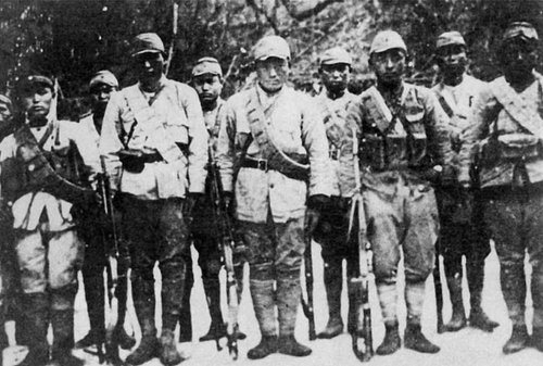 A group of Korean People's Revolutionary Army (KPRA) soldiers pose for a photograph during the anti-Japanese armed struggle. ...