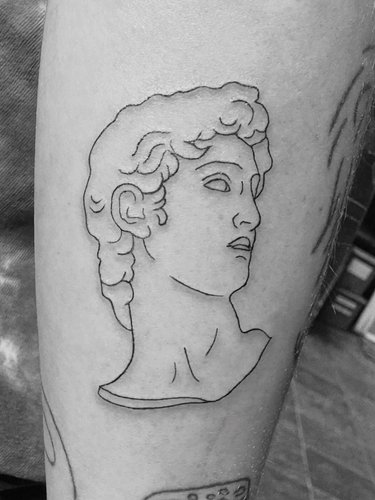 The Greek bust represents strength, intellect, and the pursuit of perfection. 
.
#FineLineTattoo #GreekMythologyTattoo #Minim...