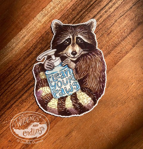 New sticker design, now available: a friendly little raccoon with a bottle of hand sanitizer, cheerfully advising to ‘Clean y...