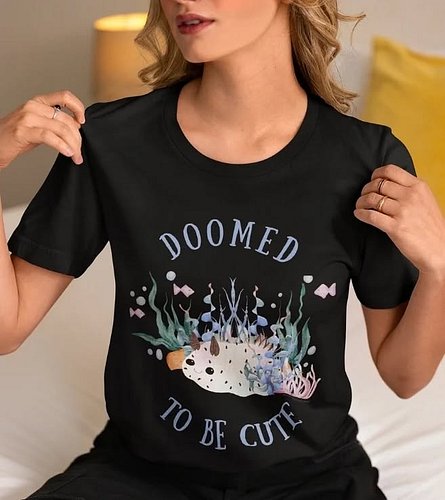 Who says you can’t be both adorable and a little ominous? This tee features the legendary sea bunny slug looking cute, confid...