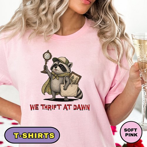 For the thrift lover who knows the best treasures are found early, this “We Thrift at Dawn” raccoon shirt brings vintage char...