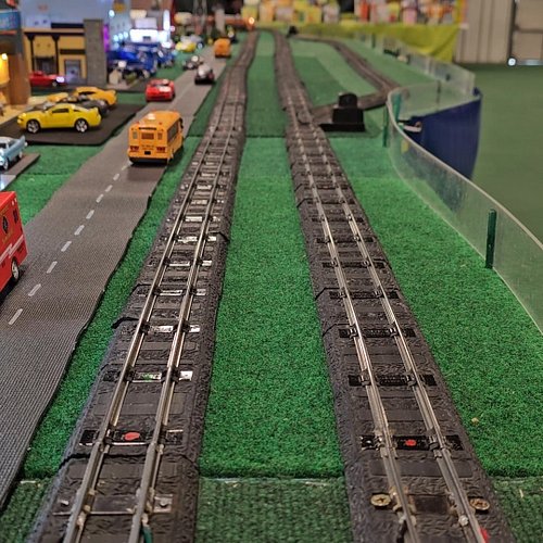 Looking down on trains as the pass. #trainshow #OT&WTrainShow #OT&WTrainShow2024 #modelrailroad