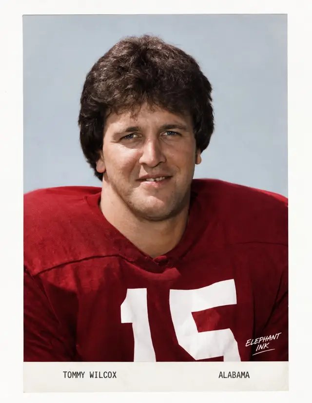 TOMMY WILCOX   A quarterback’s background. A safety’s instincts. A championship legacy. From Harahan, Louisiana, Tommy Wilcox starred at quarterback for Bonnabel High School before becoming a standout safety under Coach Paul “Bear” Bryant at Alabama.  In 1979, Wilcox earned SEC Freshman of the Year honors and helped the Crimson Tide finish 12–0, capped by a 24–9 Sugar Bowl victory over Arkansas and a national championship.  He went on to earn All-America recognition in 1981 and 1982, including consensus honors in 1981, and finished his Alabama career with 243 tackles and 25 pass breakups. Some of his biggest moments came when Alabama needed one final stop. On October 31, 1981, Mississippi State reached the Alabama 9-yard line with the game on the line. Wilcox intercepted John Bond’s third-down pass in the end zone, preserving a 13–10 Crimson Tide victory. He finished that afternoon with seven tackles, two pass breakups, and the game-saving interception.  Later that season, he intercepted another pass in the end zone during Alabama’s Iron Bowl victory over Auburn—the game that gave Coach Bryant his record-breaking 315th career win.  In 1992, Wilcox was selected to Alabama’s Team of the Century, one of just four defensive backs chosen from the program’s first 100 years.  No. 15. A national champion. A difference-maker when the game was on the line. Remembering Tommy Wilcox and his place in Crimson Tide history. Roll Tide.   — Elephant Ink