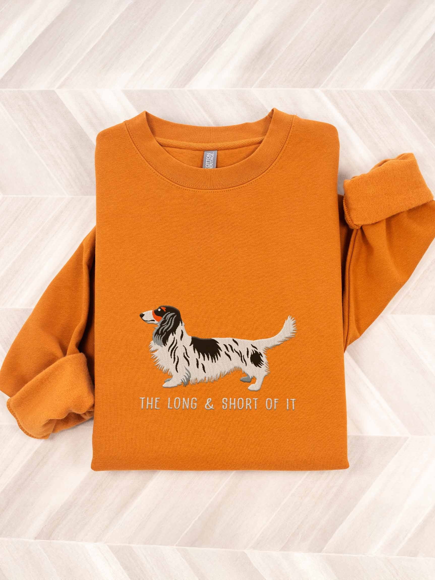 The Long & Short of It Sweatshirt (Embroidered) of a Longhaired Dachshund(Pied Black & White) product image (1)