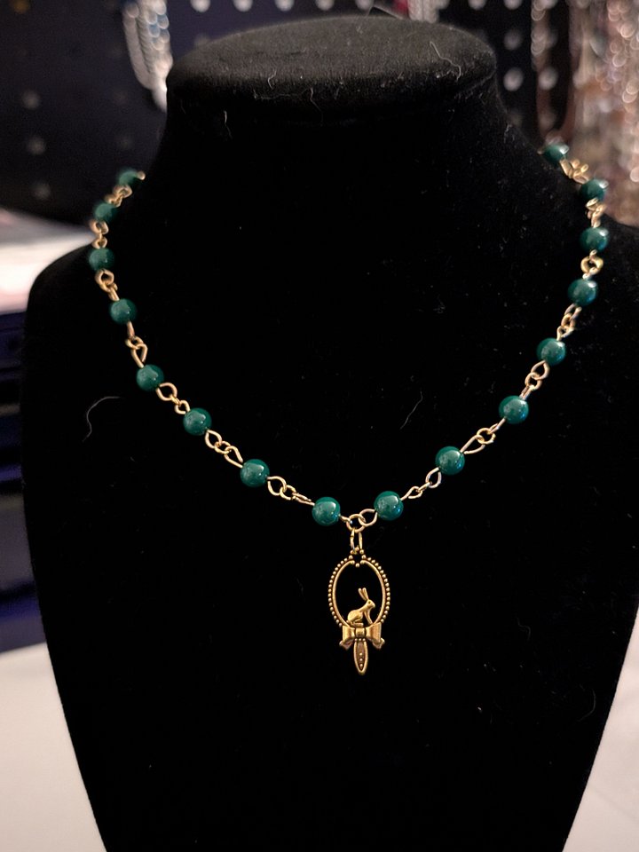 GREEN NECKLACE WITH GOLD BUNNY PENDANT product image (1)