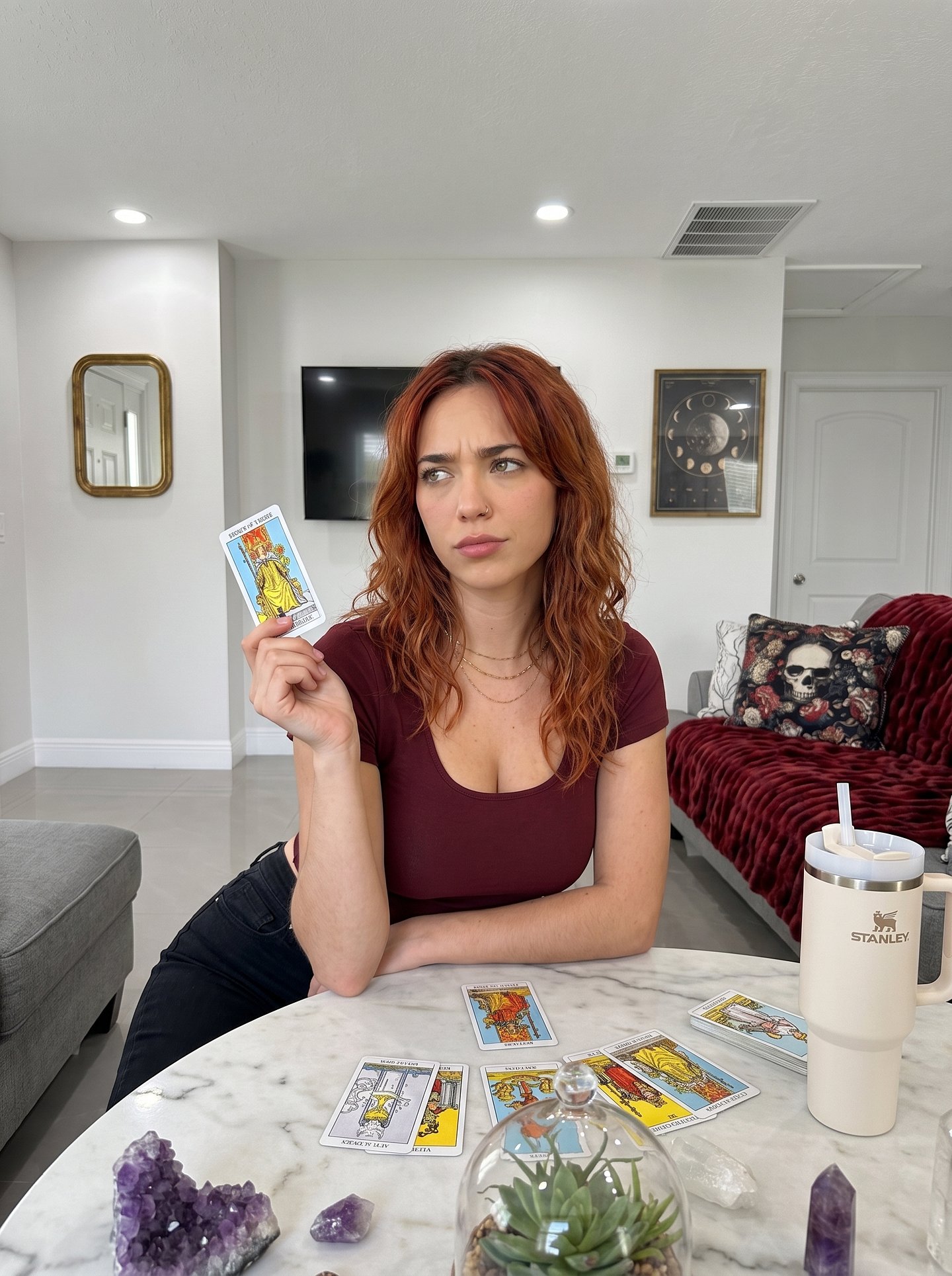 Ai Morgan holding a tarot card
