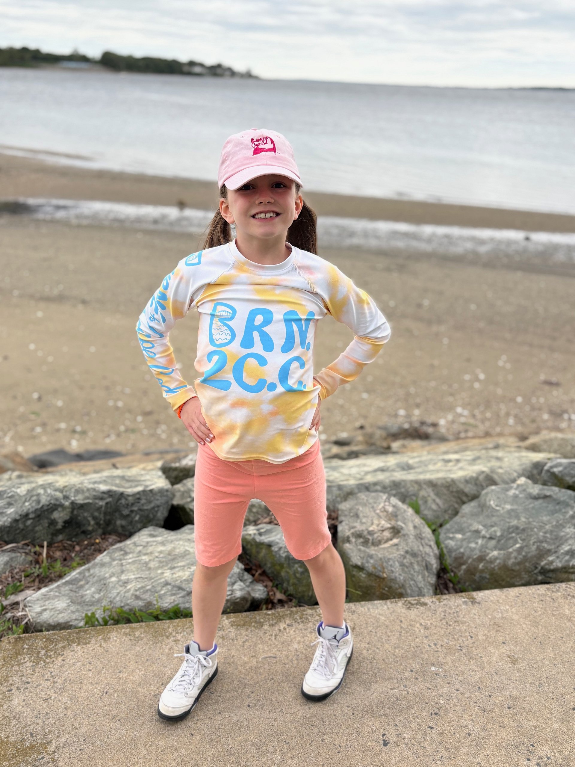 YOUTH | Rash Guard | BRN.2C.C.™ Front Graphic | BOURNE to Cape Cod™ Sleeve & Back Logo | Coastal Swim Shirt for Kids | UV Protection Activewear | Blue Logo on Orange Tie-Dye product image (5)