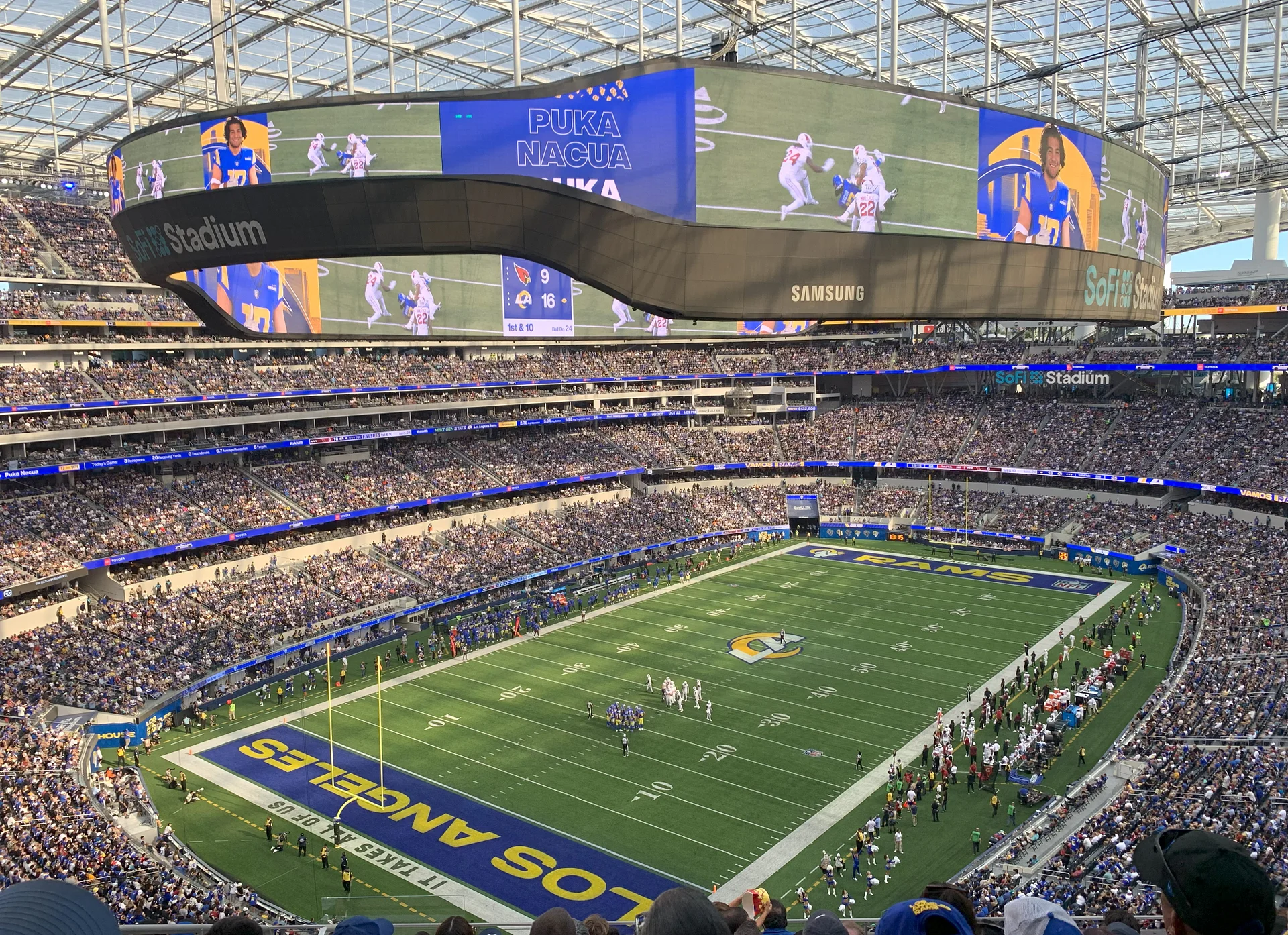 A packed SoFi Stadium crowd, representing 75,000 YouTube subscribers
