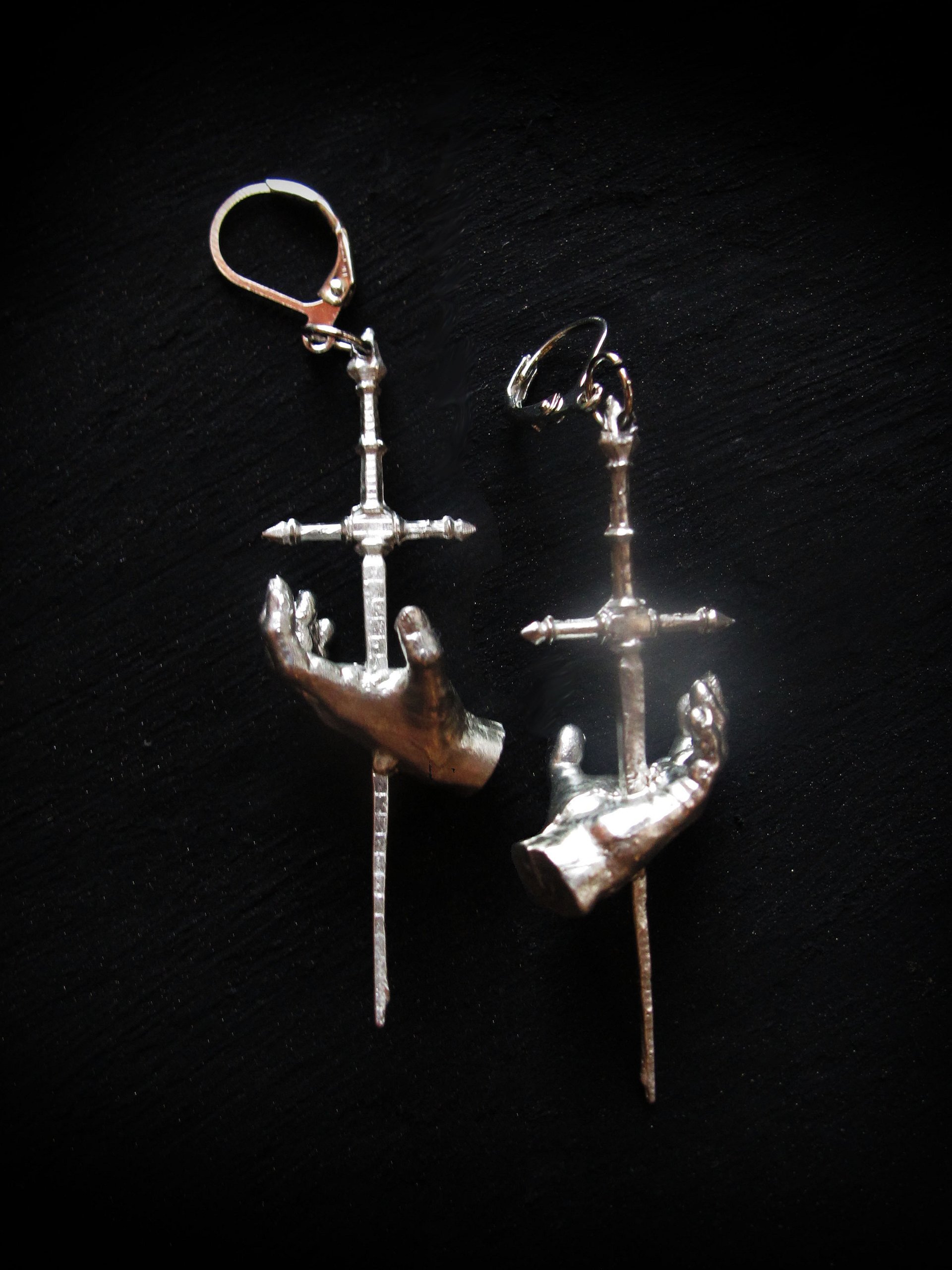 Impaled Hand Earrings product image (1)