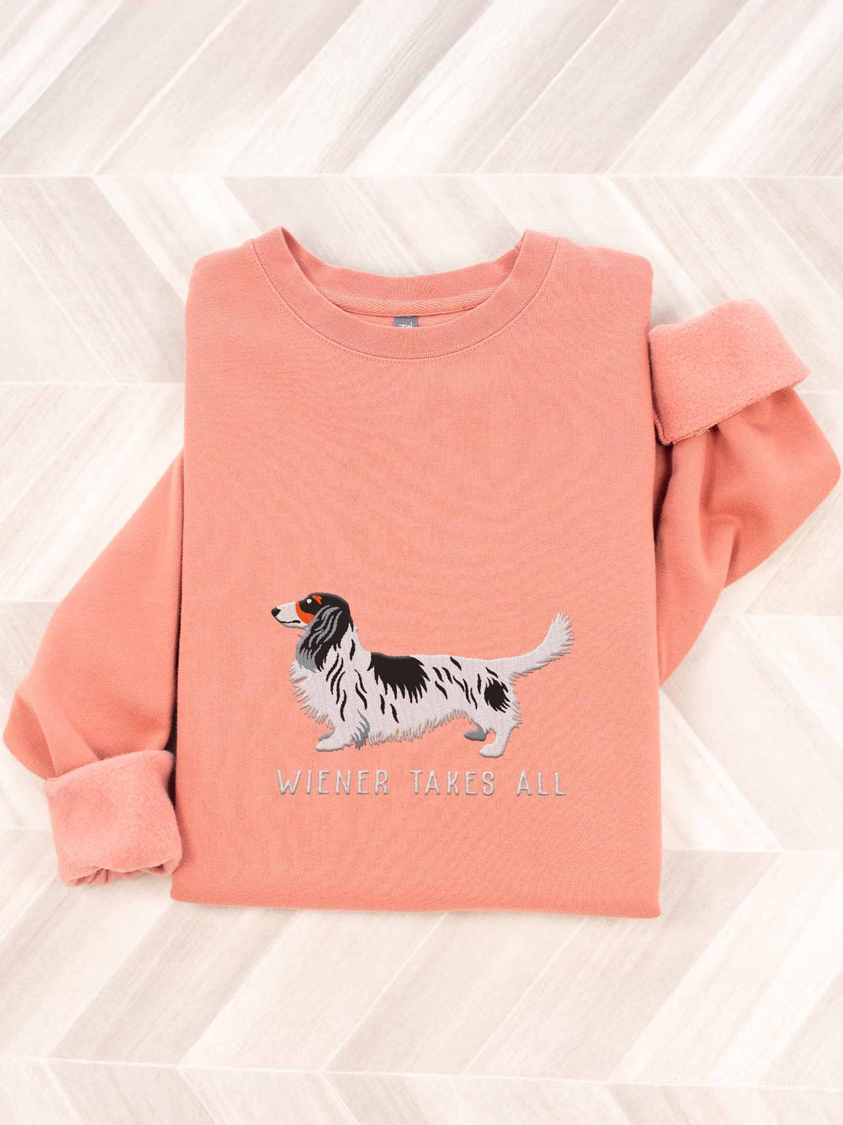 Wiener Takes All Sweatshirt (Embroidered) of a Longhaired Dachshund(Pied Black & White) product image (1)