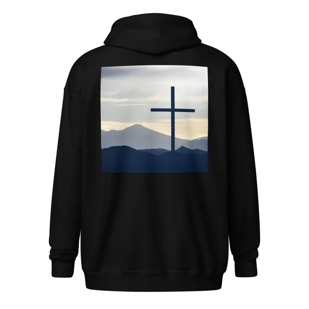 A cross standing against a serene landscape of rolling hills and distant mountains under a soft, cloudy sky Hoodie product image (1)