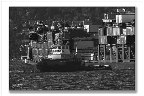 Alaska Titan breaks off the barge Provider and gets underway in Elliott Bay  containers all loaded and Alaska bound. Black an...