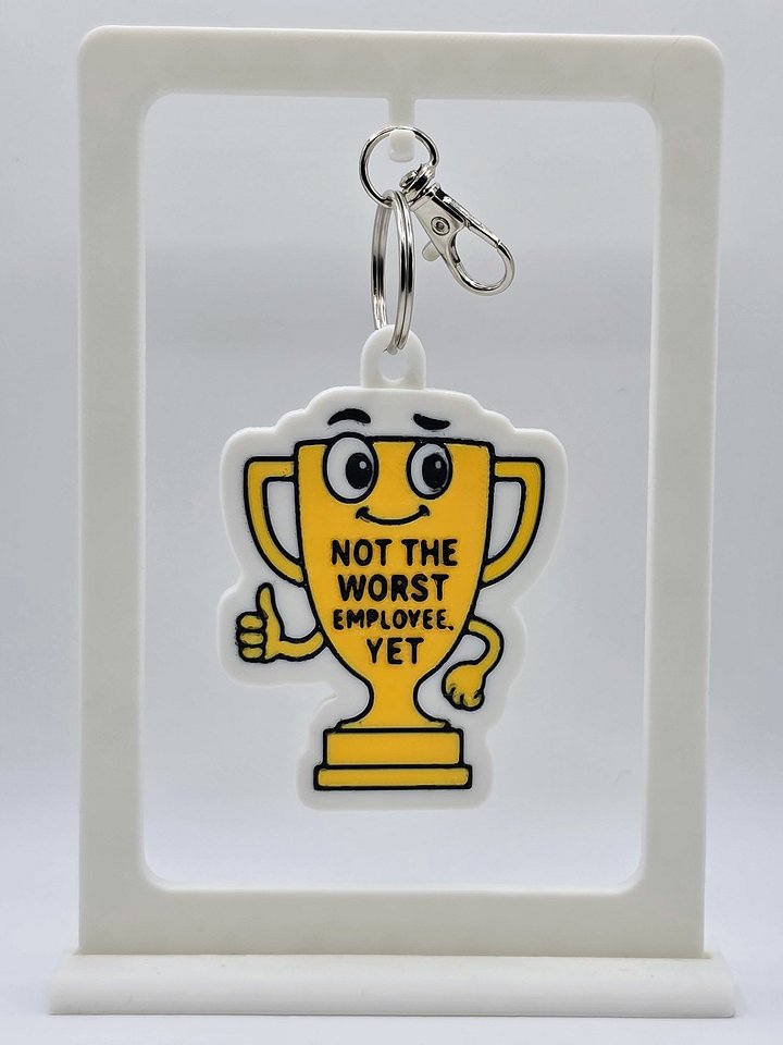 🏆 “Not the Worst Employee, Yet” Trophy Keychain product image (1)