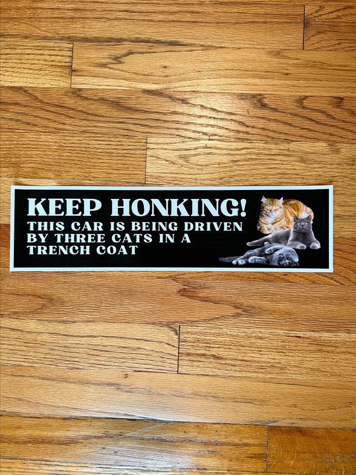 Keep honking this car is being driven by three cats in a trench coat large bumper sticker product image (2)