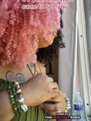 Such a beautiful Robin came to see today. Thank you ancestors!  Cowrie bracelet in the orange cart below 
