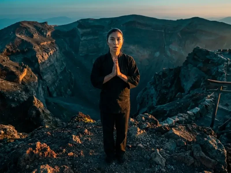 Woman chanting on Mount Fuji