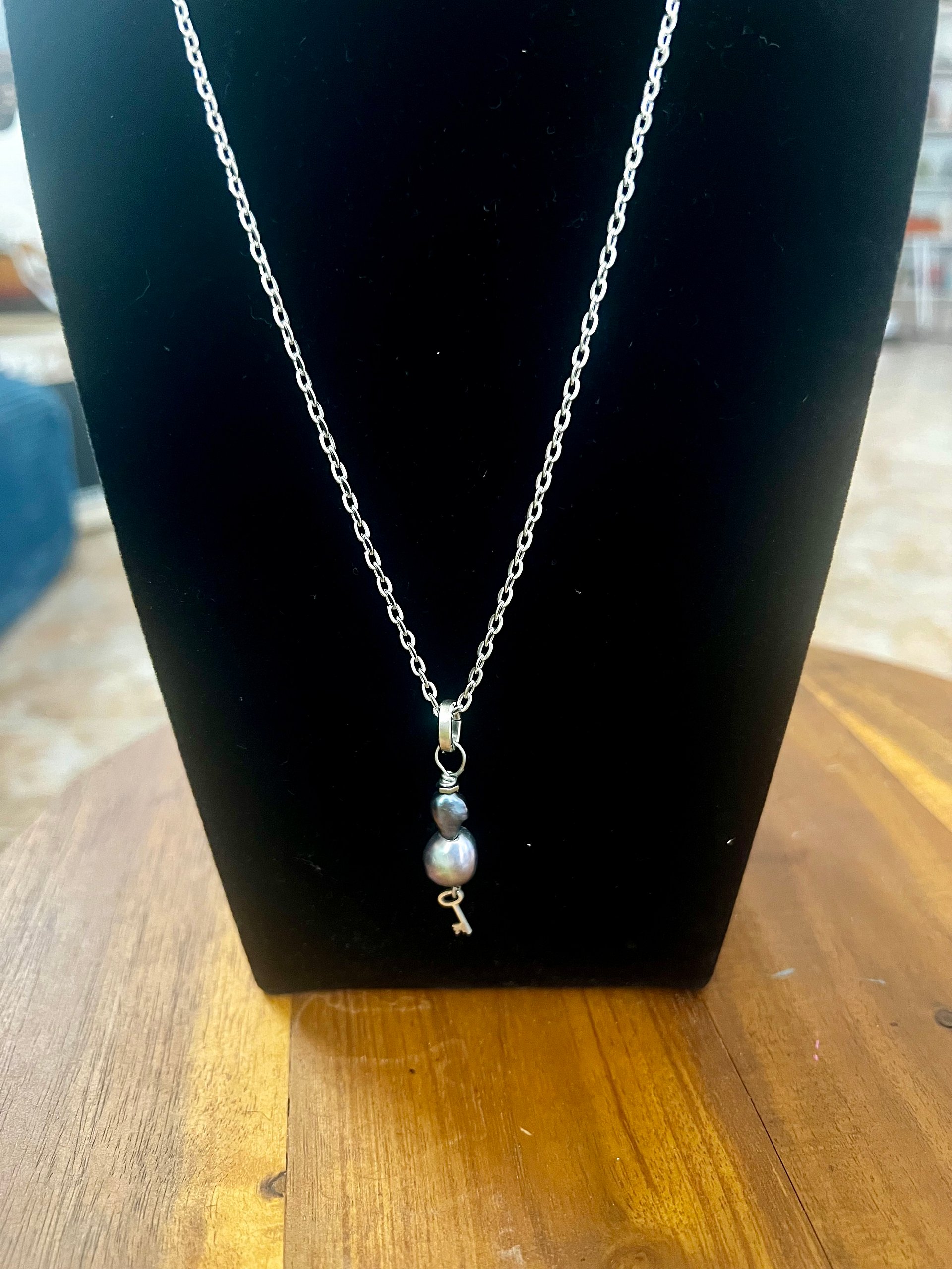 Tiny skeleton key, pyrite and peacock pearls necklace product image (1)