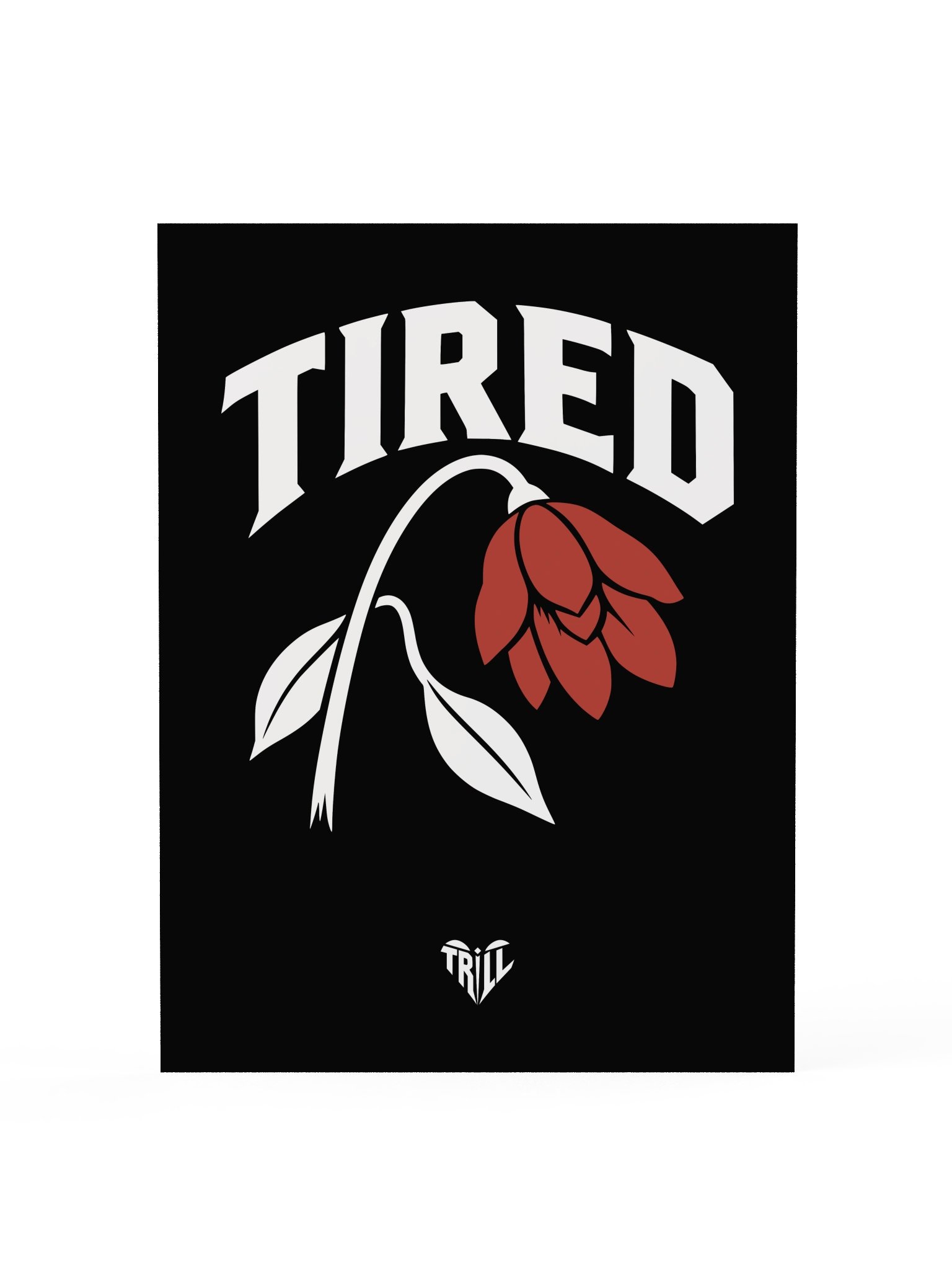 Unframed black TIRED art print with white lettering, red flower and small TriLL heart