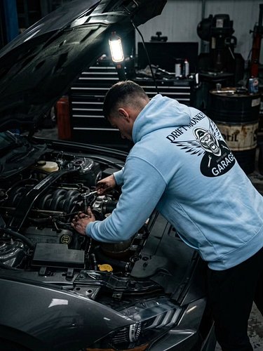 Hands dirty, hood up, and torque specs dialed in. 🔧⚡
​The Drift Monkey Garage baby blue hoodie is engineered for cold nights ...