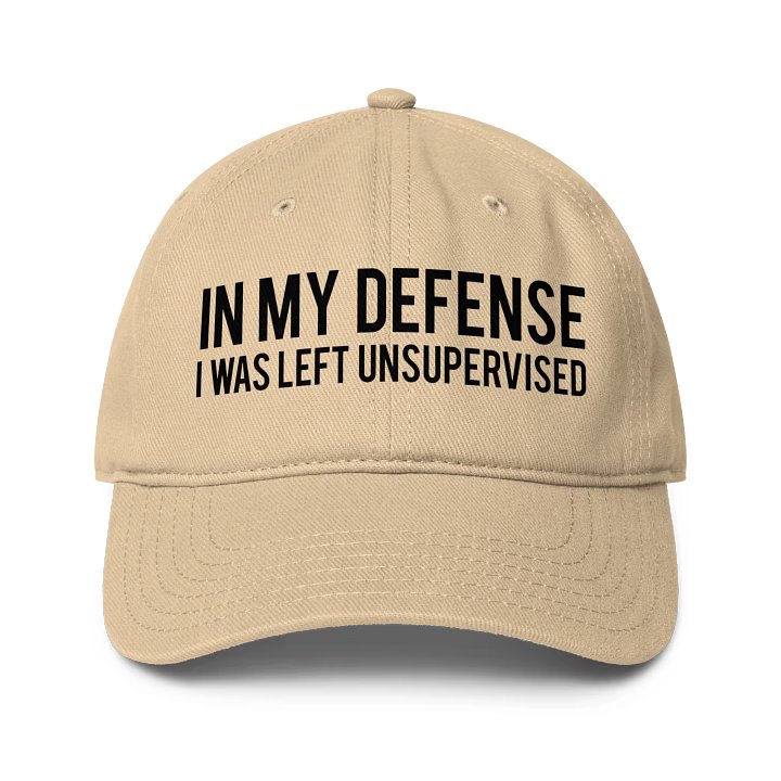 Khaki “In My Defense I Was Left Unsupervised” hat, unstructured cotton twill cap with adjustable Velcro closure and curved visor