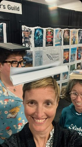 Author shenanigans @ the NE state fair. Met some great readers & had a blast 💥. Thank you all!