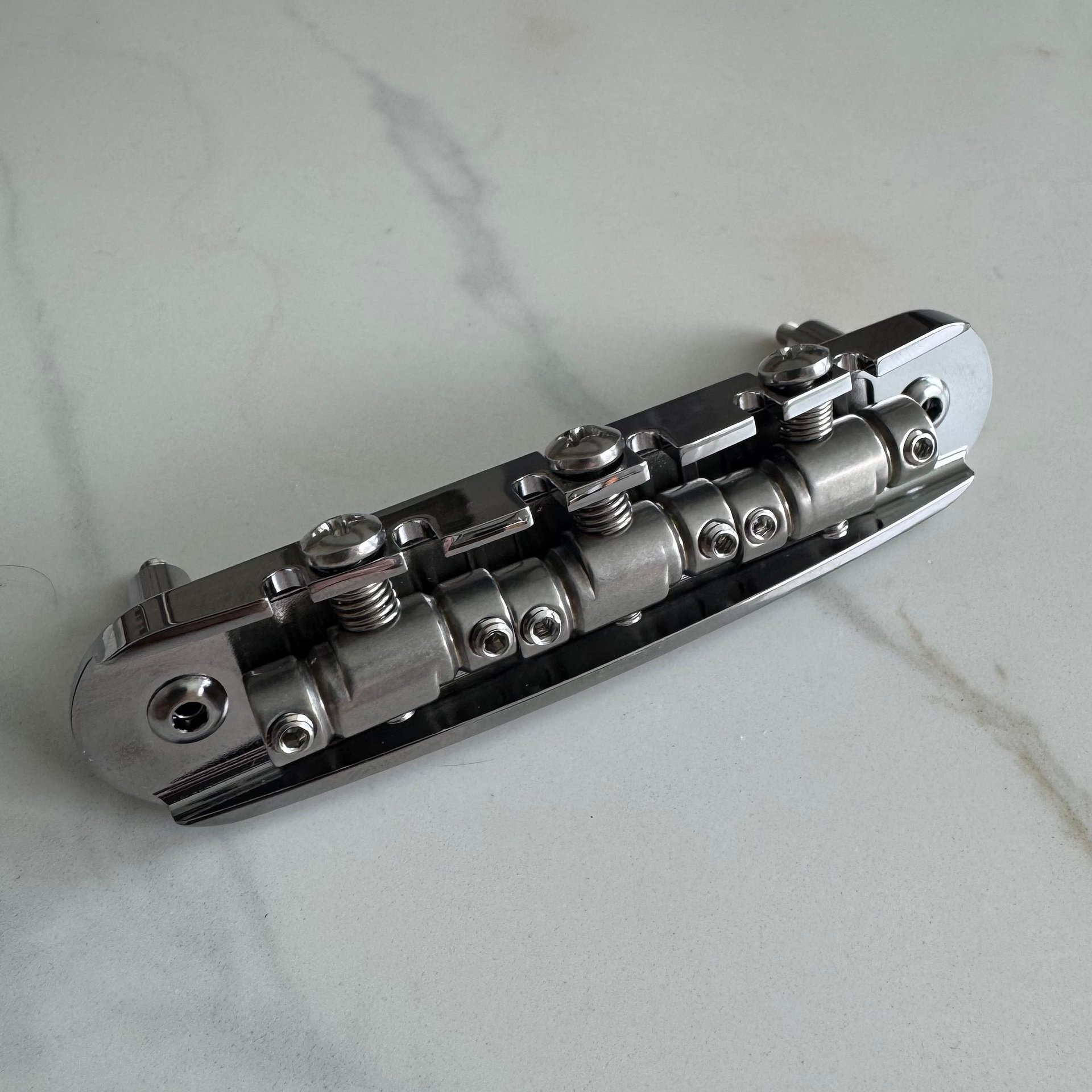 “The Goliath” Chrome-Plated Brass Jazzmaster / Jaguar / Mustang Bridge with USA Made Compensated Stainless Steel Saddles product image (3)