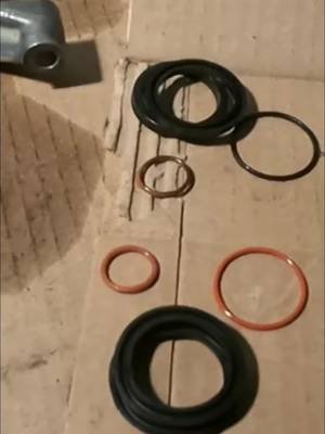 Repair kit essentials! From old to new, see the worn-out parts and one O-ring that got a little too toasty. #MechanicLife #CarRepair #AutoTech #DIY