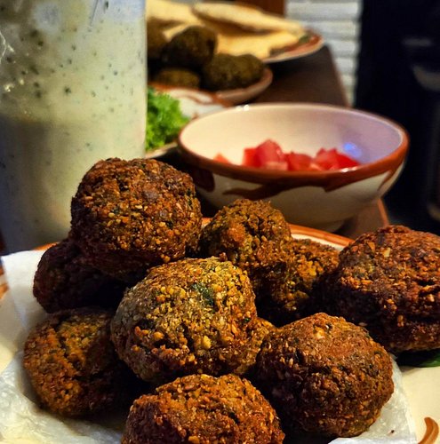 Falafel from scratch, lettuce, tomatoes, pita from scratch, and a bunch of dairy-free tzatziki from scratch for my beloved la...