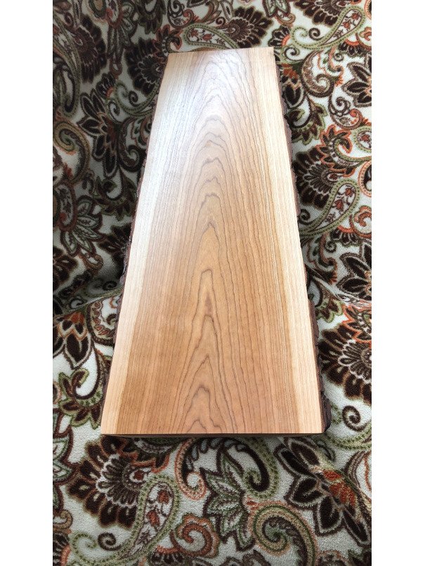 24" x 7"-9" Cherry live edge Charcuterie board with no handle and silver colored feet product image (1)