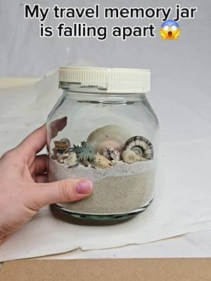There was a time when I used to travel. ✈️🧳 My visited places had beaches, so I collected some sand, shells, and a couple of rocks for my memory jars. 🏖️🐚 They are 10 years old, and the plastic lids started disintegrating. ⏳😟 I made new ones from cardboard. ♻️🎨 To make them more interesting, I decorated them with what I had at hand—extra seashells, rocks, and pearls. 🐚🪨✨ #travel #travelmemories  #decorativejars #reuserecycle 