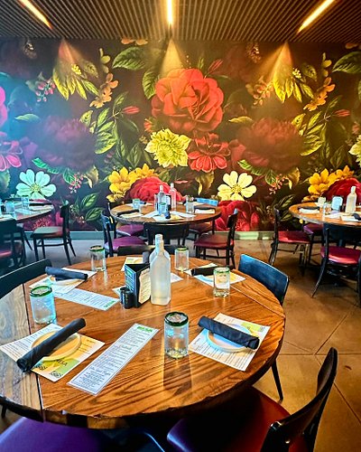 Our Private Dining Room Features a Floral Mural Wall on One Side and 2 Shutter Walls that can be opened or closed for a more ...