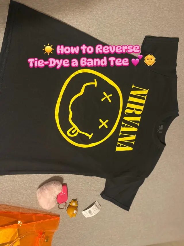Grab a dark-colored tee (I used a black Nirvana shirt 🤘🖤), some gloves 🧤, rubber bands, and bleach in a squeeze or spray bottle. ☀️ Pick a pattern you love (I chose a sunburst!), tie your shirt, and carefully apply the bleach where you want the design to appear. ⏳ I checked mine after about 3 minutes, then let it sit for around 10 minutes total for a brighter look. Your timing may vary depending on how light you want your design. 💦 Once you’re happy with the color, remove the rubber bands and thoroughly rinse the shirt to stop the bleaching process. Then wash or dry it like normal—I let mine air dry! 🌴☀️ I had so much fun making this! 🌺✨ If you recreate it, tag me because I’d LOVE to see your designs! 💖 #DIY #tiedye #summerproject #reversetiedye  #onthisday 