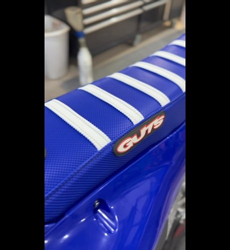 Installing the GUTS Racing Wide Seat Foam + Gripper Seat Cover for more comfort, control, and grip on the bike. 🏁