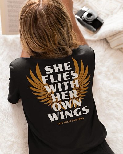 “SHE FLIES WITH HER OWN WINGS” - Available now in a variety of styles, colors, and sizes. 

“She Flies With Her Own Wings” wa...