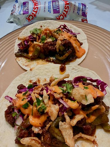 Beef Stir-Fry Tacos w/ Tangy Slaw, Srichacha Mayo & Crispy Fried Onions. (and a drumstick)