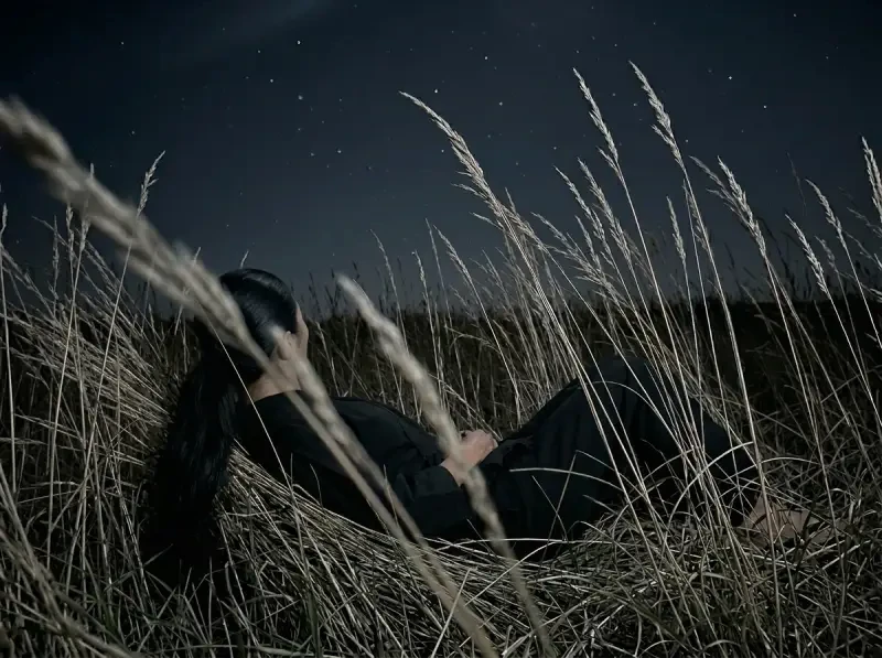 Woman lying in grass