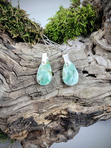 These stunning light green chrysoprase teardrops are beautifully accented with sterling silver, creating a pair of earrings t...