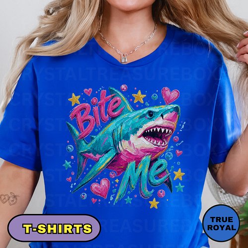 Make a bold splash with this colorful “Bite Me” shark shirt, featuring a vibrant hand-painted-style shark surrounded by playf...