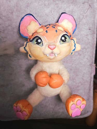 🌸🐯 my first art doll attempt using wool and clay.

I needle felted the body and limbs, sculpted the paws and head with clay, ...