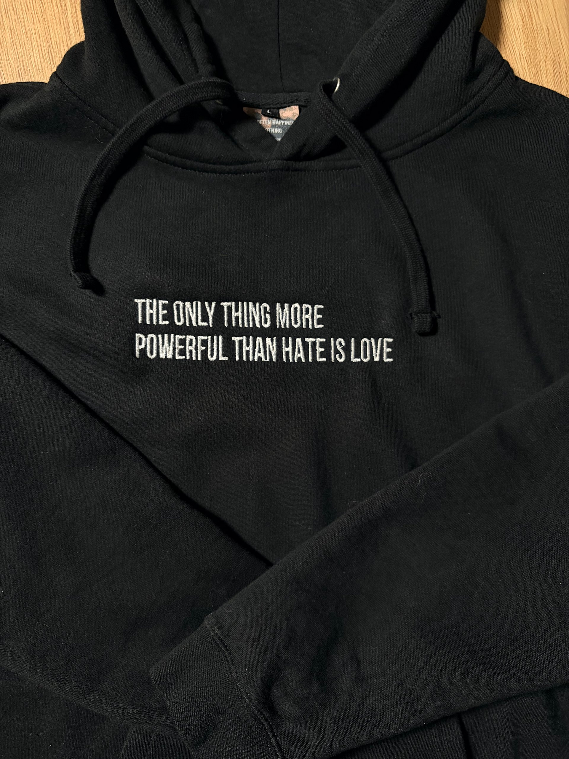 Unisex The only thing more powerful than hate is love Sweatshirt product image (1)