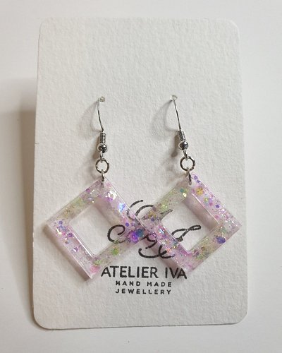 Check this out!!!!

 Pink & Yellow Holographic Glow-in-the-Dark Diamond Earrings https://www.jandivision.co.uk/products/pink-...