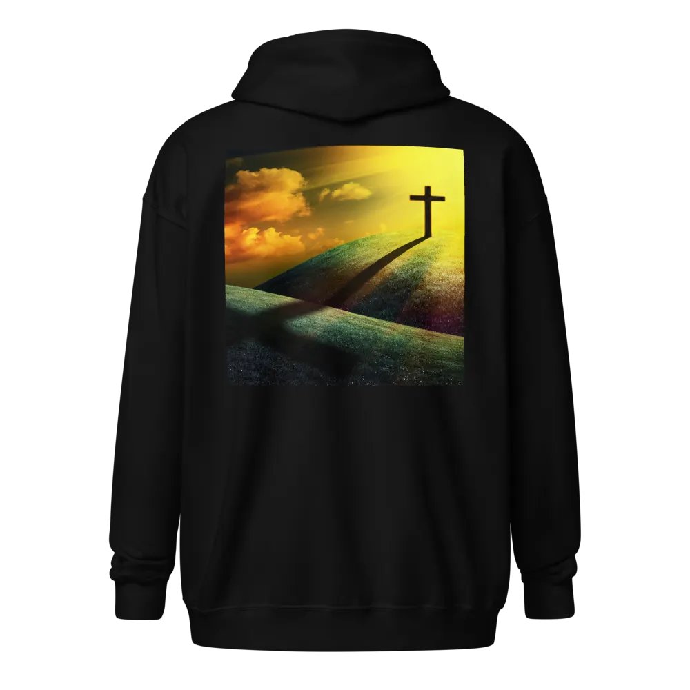 A cross standing prominently on a grassy hill, with a vivid, dramatic background Hoodie product image (1)