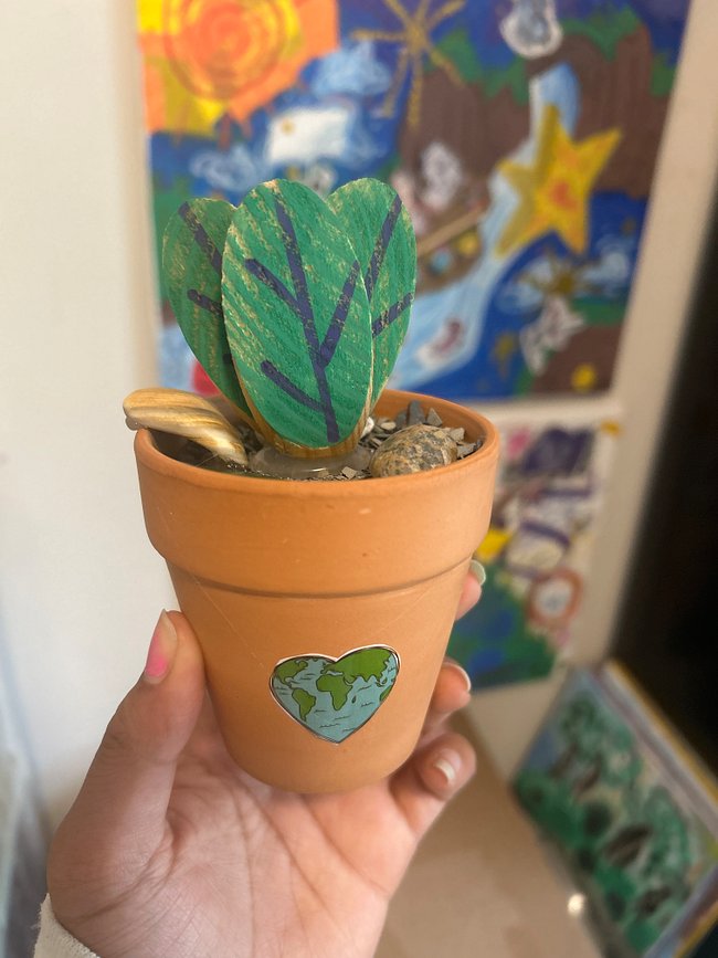 Upcycled handmade faux plant scenes in pots