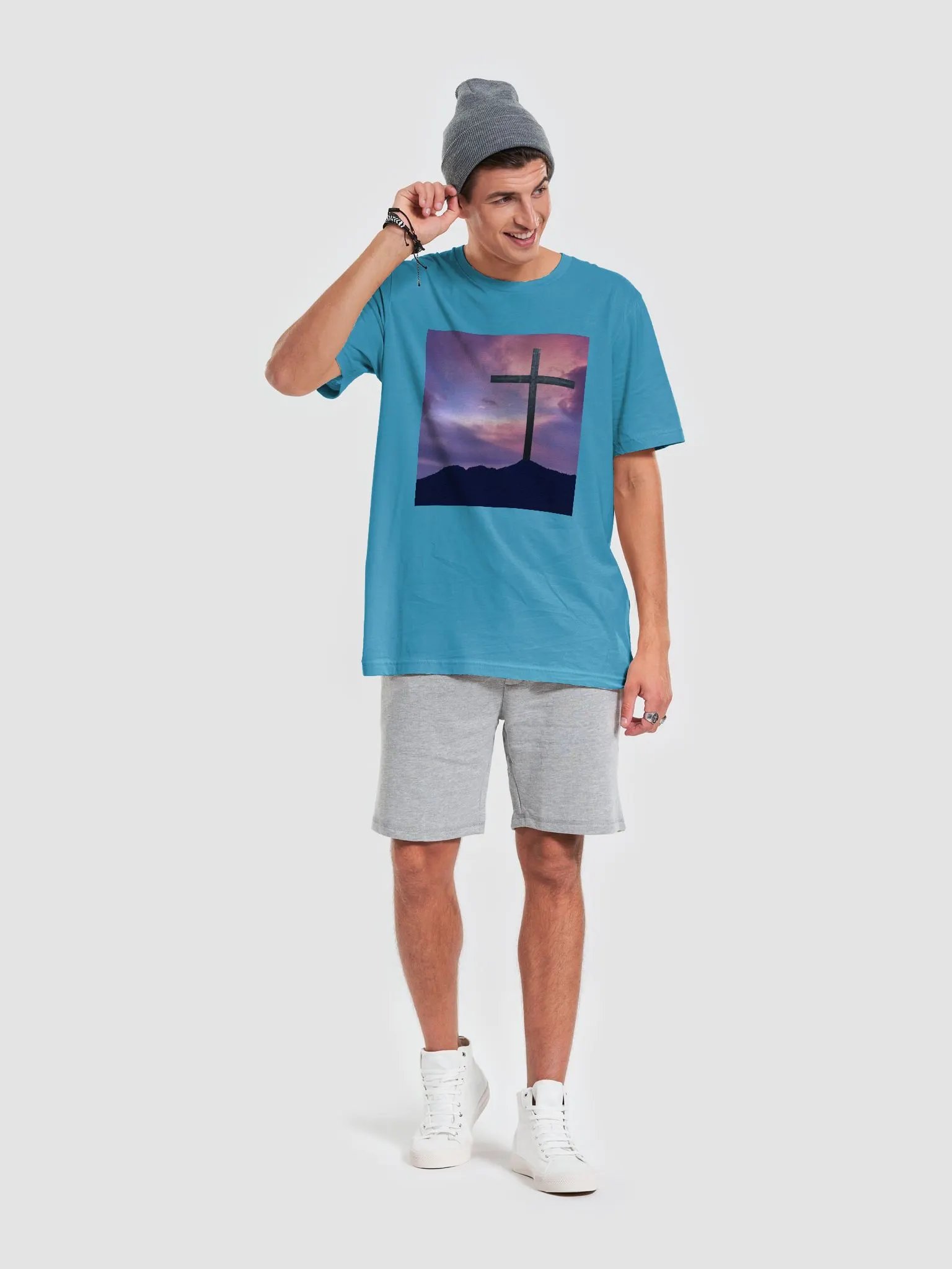 Wooden cross standing on a hill, silhouetted against a vibrant and colorful sky transitioning from deep purples to pinks t-shirt product image (8)