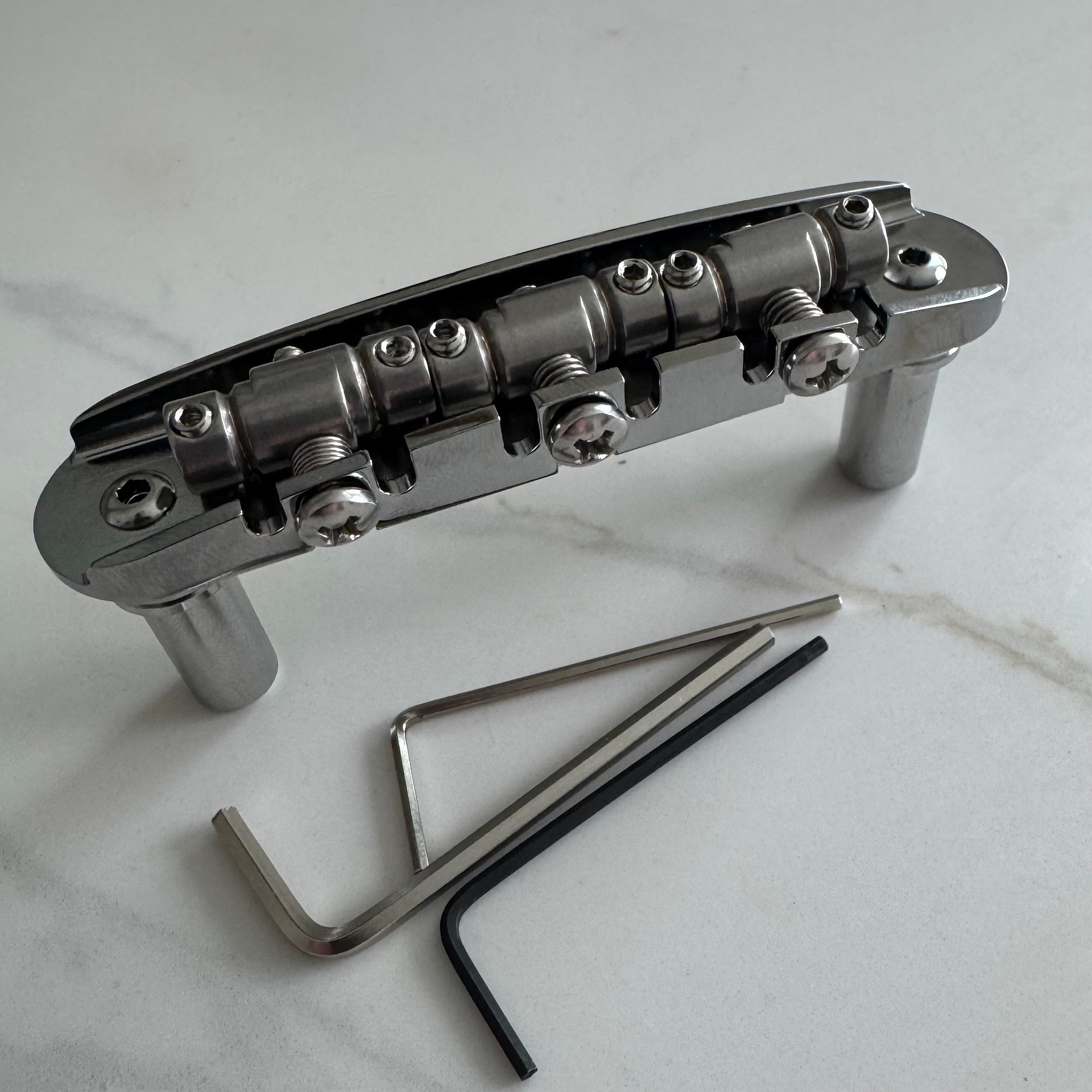 “The Goliath” Chrome-Plated Brass Jazzmaster / Jaguar / Mustang Bridge with USA Made Compensated Stainless Steel Saddles product image (1)