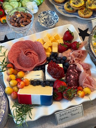 This “Satisfied” Cheese Board seen at my Hamilton party has 1776 cheddar cheese, red fruits, blueberries and blue cheese, a s...