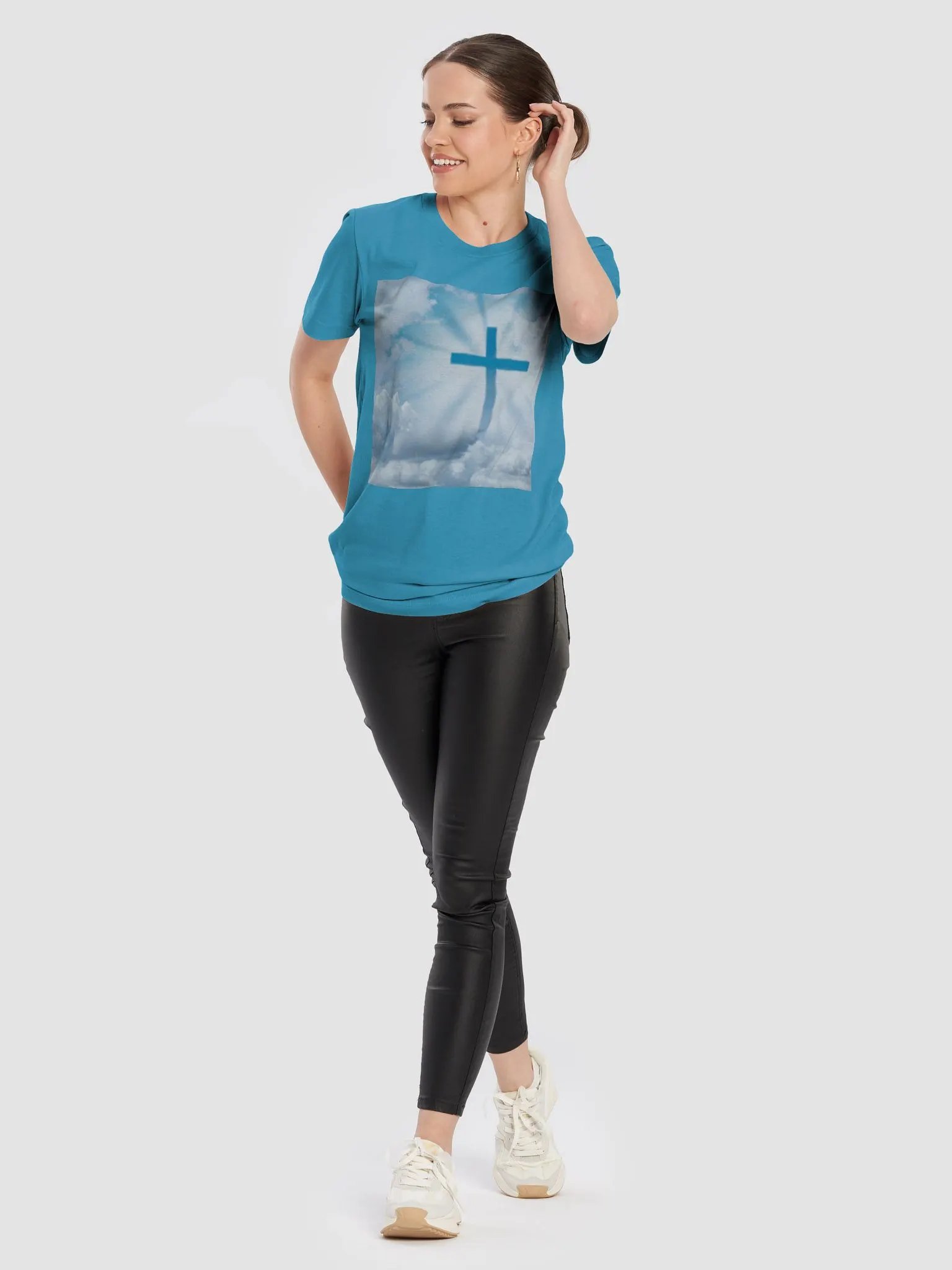 A cross surrounded by a heavenly scene, with rays of light shining through soft clouds in a bright blue sky t-shirt product image (4)