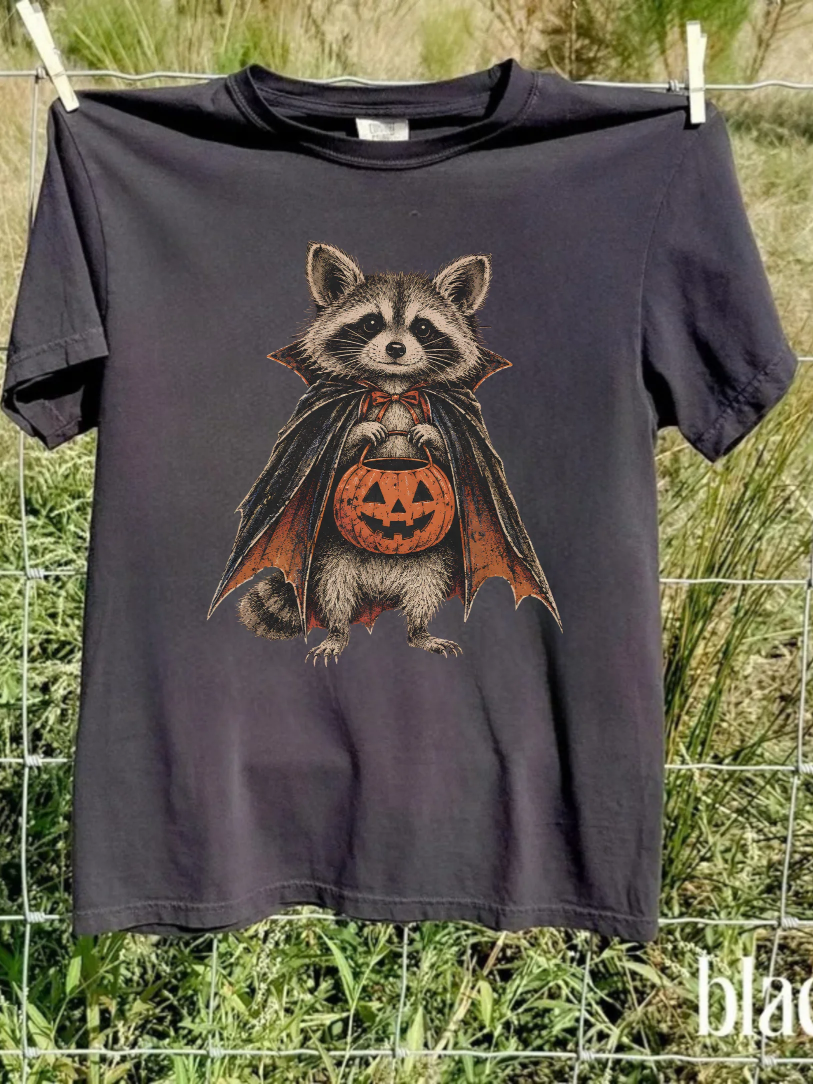 Halloween Raccoon T-Shirt, Cute Pumpkin Raccoon Tee, Vintage Spooky Animal Shirt, Funny Fall Halloween Shirt, Raccoon Lover Gift product image (1)